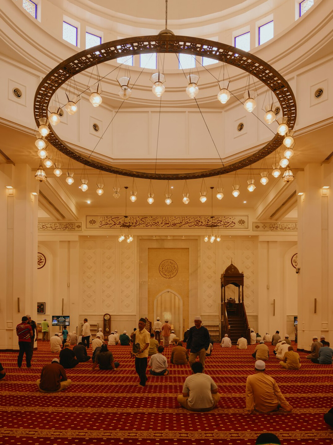 Audience seated in a large hall during an event